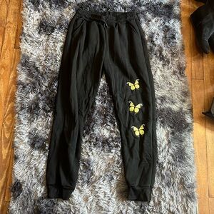 Black sweats with yellow butterflies